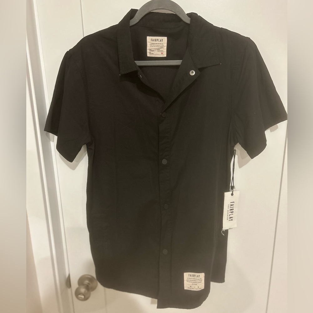 Men’s black FairPlay Los Angeles brand polo